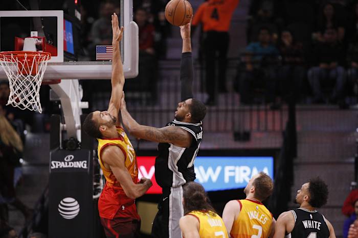 Rudy Gobert (27) contests the shot of LaMarcus Aldridge (12)